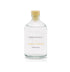 A cider apple scented reed diffuser refill from the Home County Co is shown in its recyclable glass refill bottle.