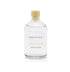 A coastal blossom scented reed diffuser refill from Home County Co. The eco friendly reed diffuser refill is shown in its recyclable glass bottle.