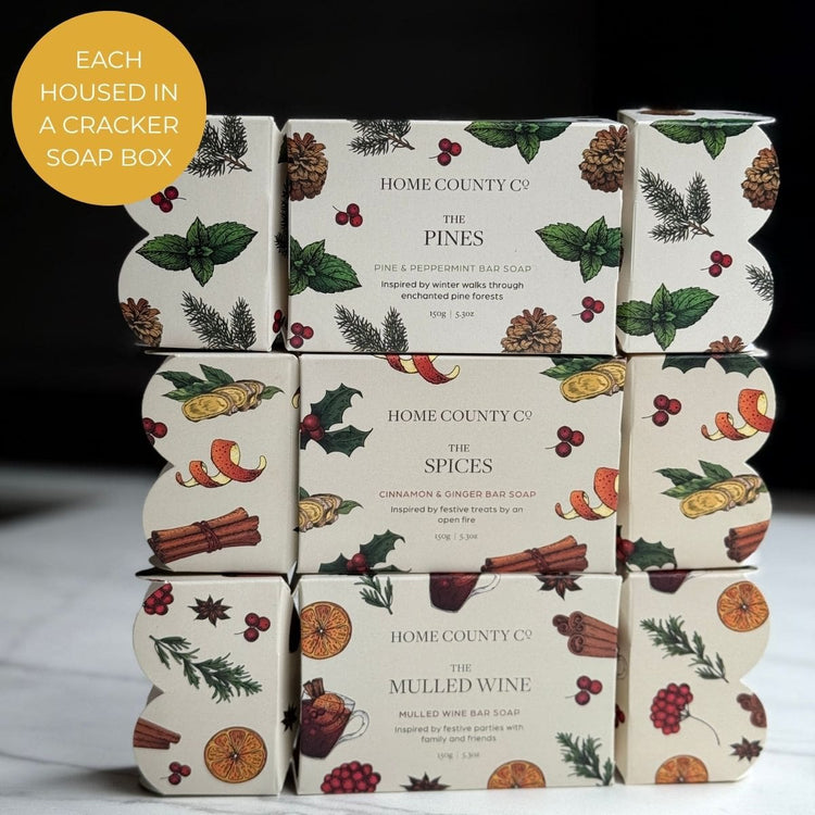 Home County Co. Christmas Soap Bar Crackers are shown stacked on top of each other