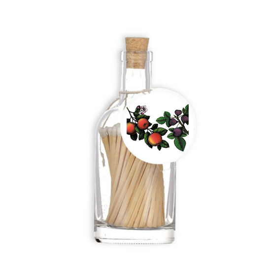 A luxury glass match bottle from the Home County Co. with Apple and Fig illustrated gift tag.
