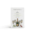 A prosecco scented natural soap bar from the Home County Co. is shown in its prosecco illustrated recyclable soap bar wrap