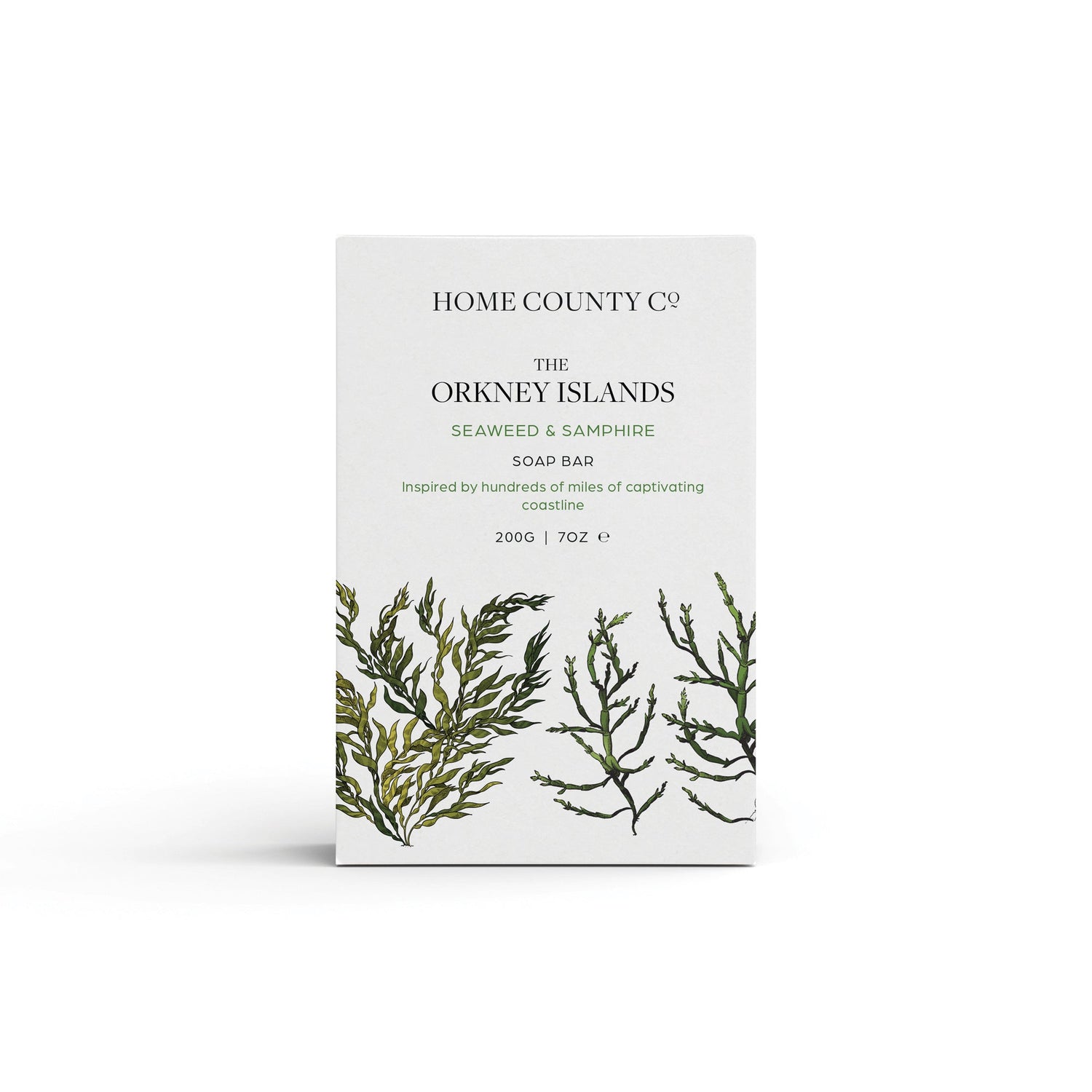 A seaweed and samphire scented natural soap bar from the Home County Co. is shown in its seaweed illustrated recyclable soap bar wrap