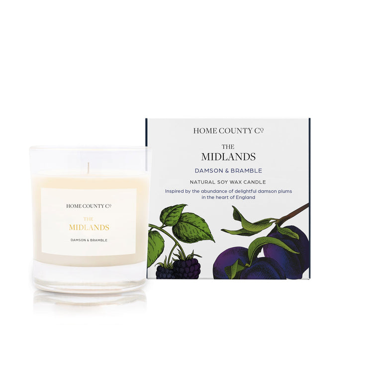 A damson and bramble scented soy wax candle inspired by the Midlands is shown next to its sustainable candle box with plum illustration