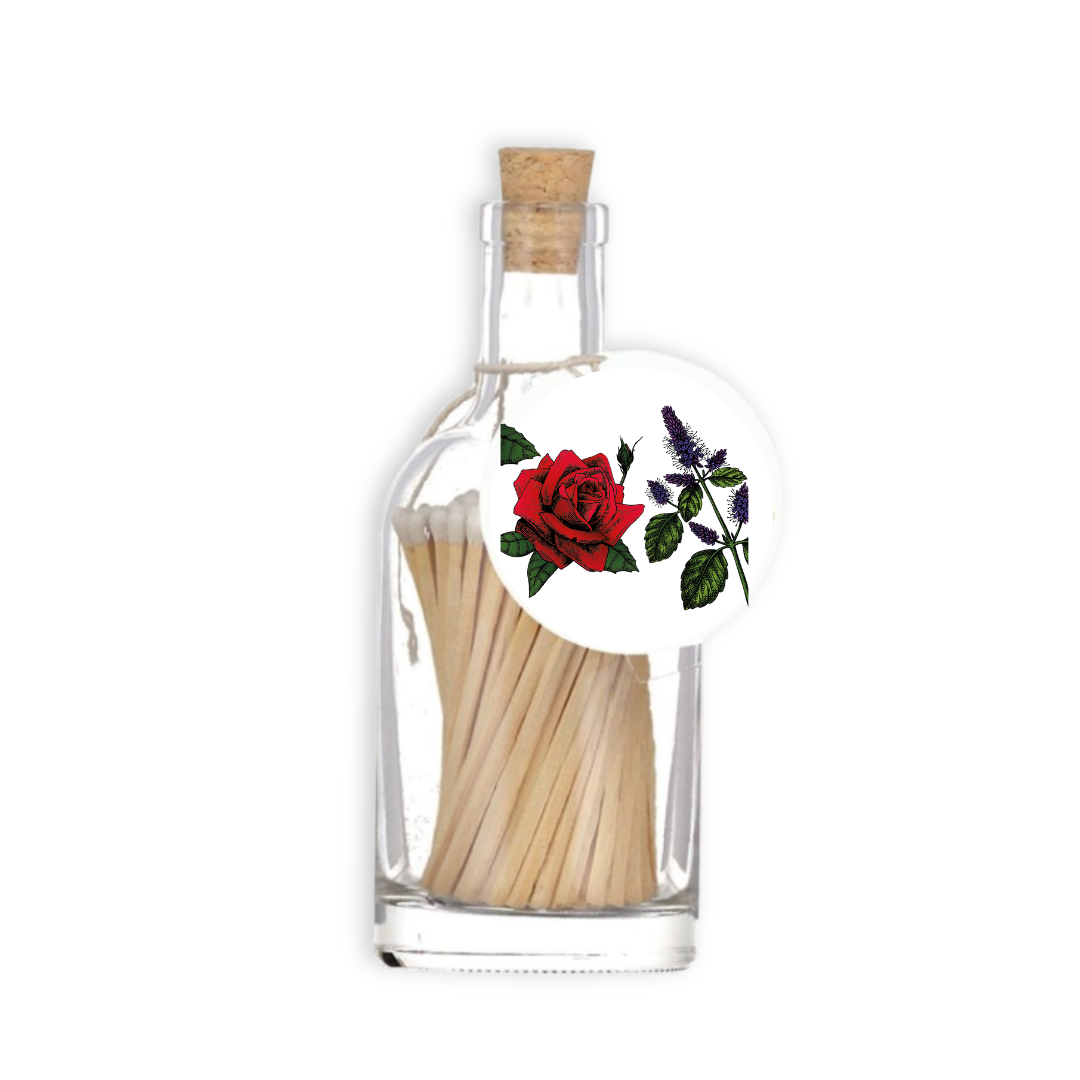 A luxury glass match bottle from the Home County Co. with Red Rose illustrated gift tag.