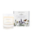 An English lavender and chamomile scented soy wax candle inspired by Surrey is shown next to its sustainable candle box with lavender illustration