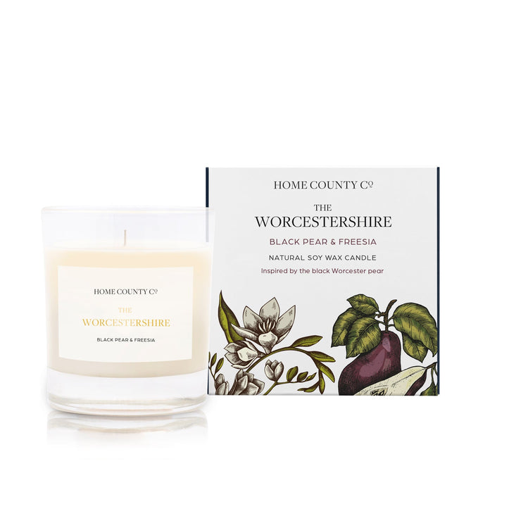 A black pear and freesia scented soy wax candle inspired by Worcestershire is shown next to its sustainable candle box with pear illustration