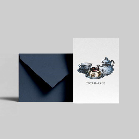 A cream tea illustrated greeting card with you're tea-rrific message from the Home County Co. is shown with its navy envelope.