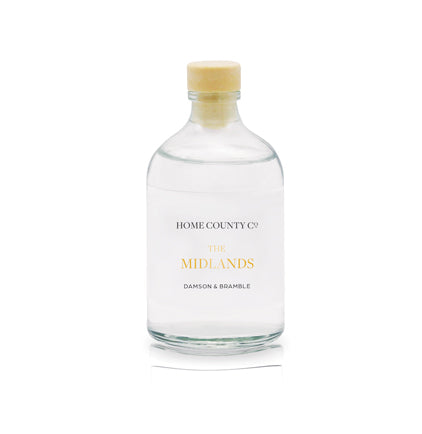 A damson and bramble reed diffuser refill is shown in a recyclable glass bottle