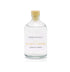 A cedar and wild berries reed diffuser refill is shown in a recyclable glass bottle