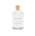 A cassis and black vanilla reed diffuser refill is shown in a recyclable glass bottle