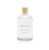 A clean cotton reed diffuser refill is shown in a recyclable glass bottle