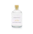 An English lavender and chamomile reed diffuser refill is shown in a recyclable glass bottle