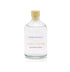A black pear and freesia scented reed diffuser refill from Home County Co. The eco friendly reed diffuser refill is shown in its recyclable glass bottle.