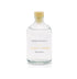 An Irish whiskey scented reed diffuser refill from Home County Co. The eco friendly reed diffuser refill is shown in its recyclable glass bottle.
