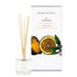An amber and sweet orange scented reed diffuser from Home County Co. The vegan friendly reed diffuser is shown next to the eco friendly reed diffuser box packaging.
