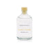 A parchment and quill scented reed diffuser refill from Home County Co. The eco friendly reed diffuser refill is shown in its recyclable glass bottle.