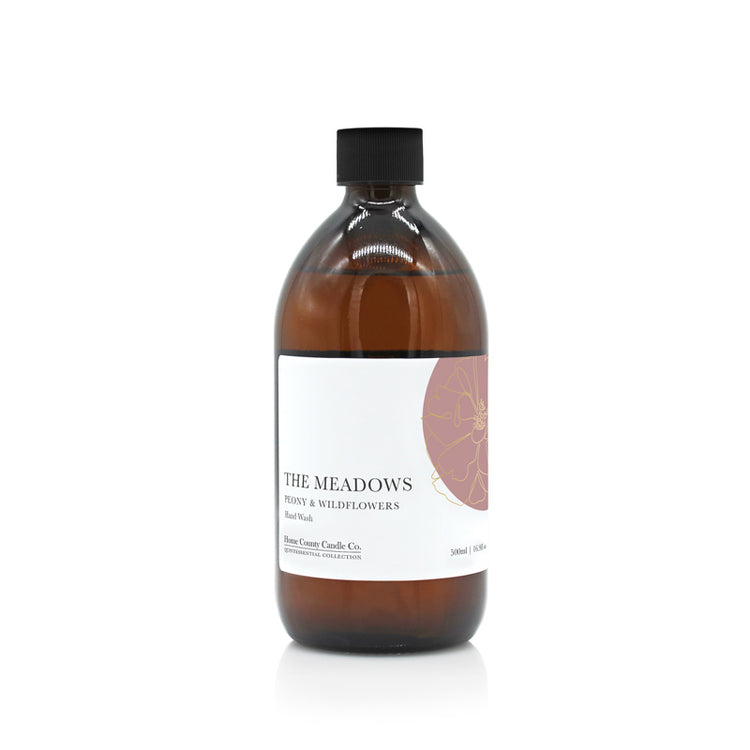 A 500ml floral peony and wildflowers scented liquid hand wash refill from the Home County Co. is shown in its eco-friendly amber glass bottle