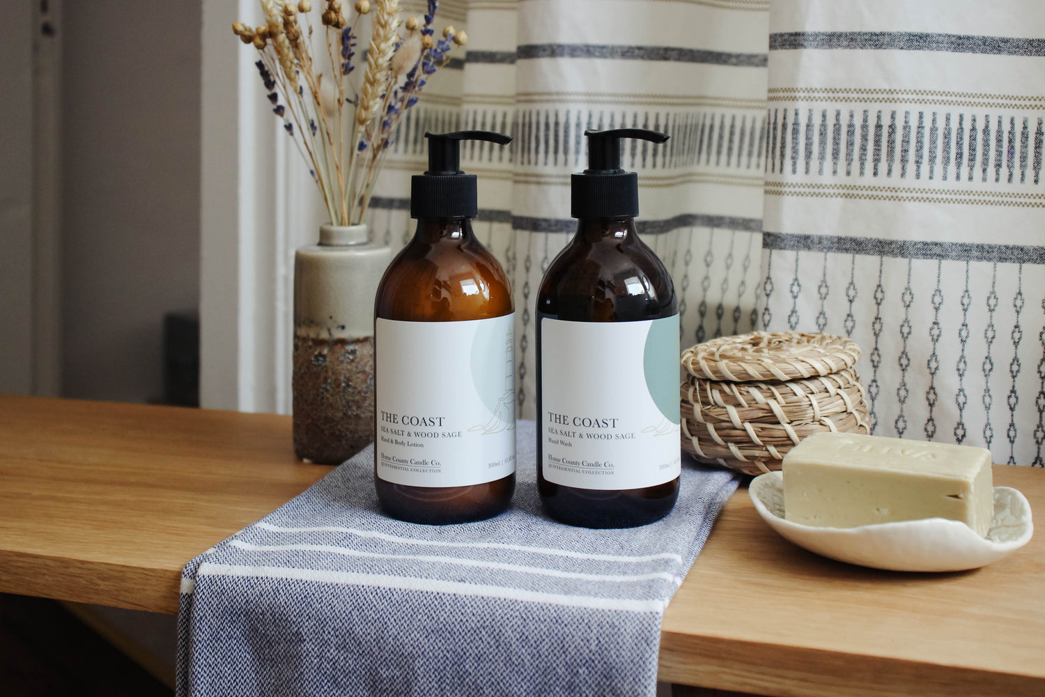 Coastal sea salt and wood sage hand soap and lotion hand care duo in sustainable amber glass bottles