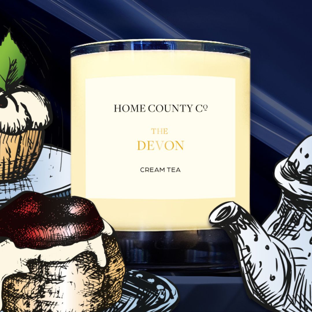 Devon Cream Tea candle from the Home County Co is shown with illustrated teapot and scone