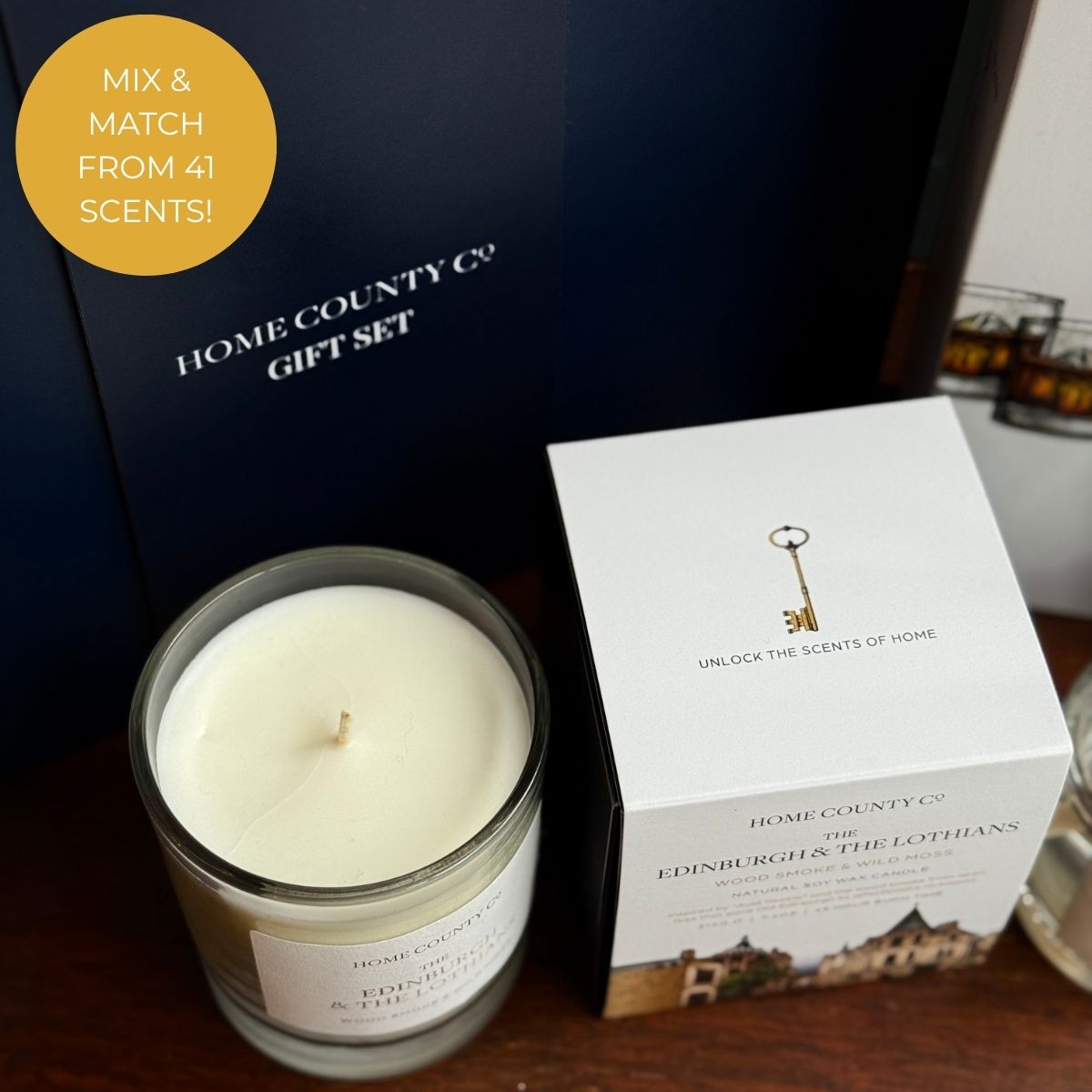 Home County Co. Edinburgh candle in front on luxury navy gift box with mix and match from 41 scents callout
