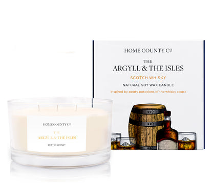 A beige 3-wick soy candle with &