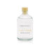 A freshly cut grass scented reed diffuser refill from the Home County Co is shown in its recyclable glass refill bottle.