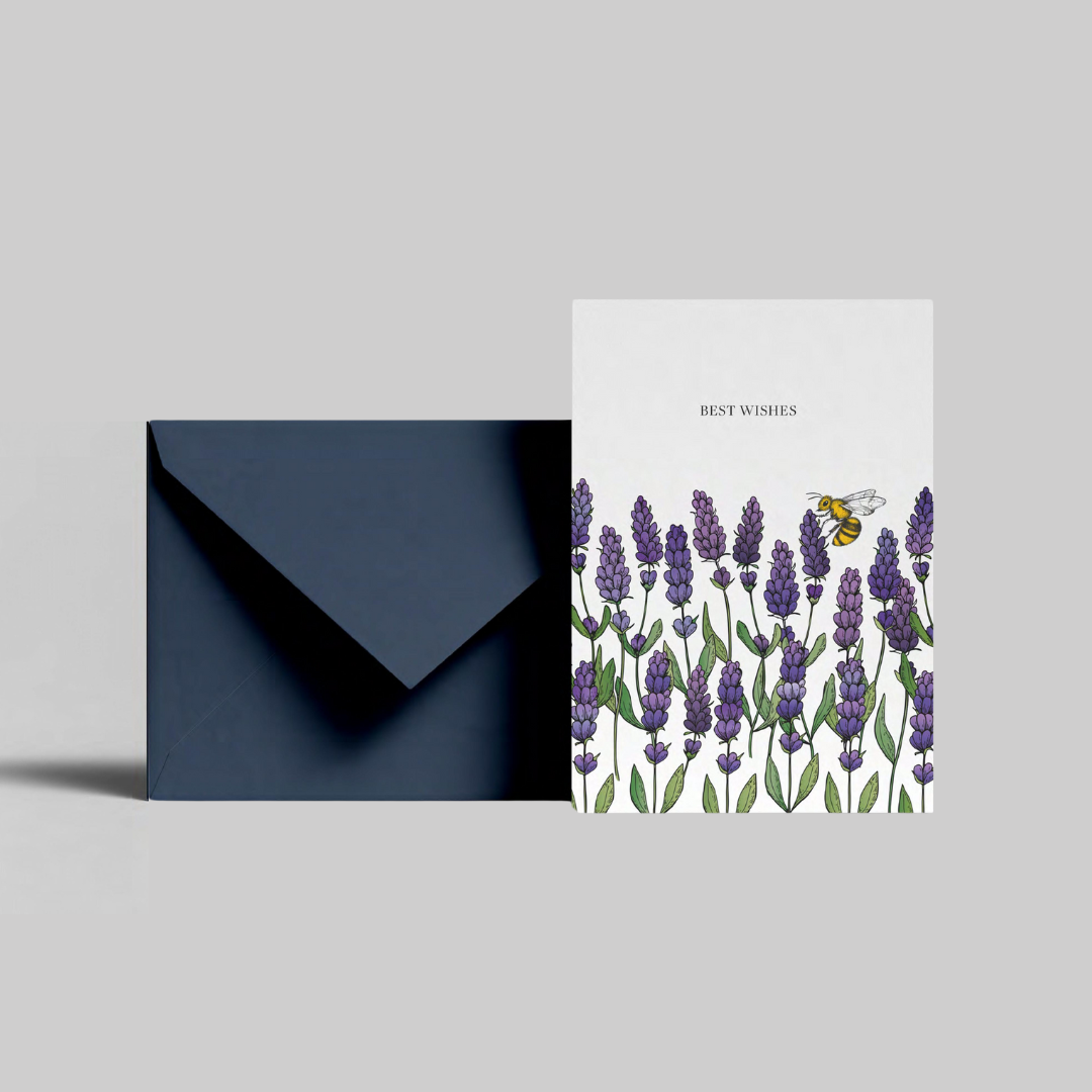 A lavender illustrated greeting card with best wishes message from the Home County Co. is shown with its navy envelope.