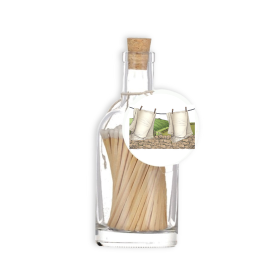 A luxury glass match bottle from the Home County Co. with clean washing illustrated gift tag.