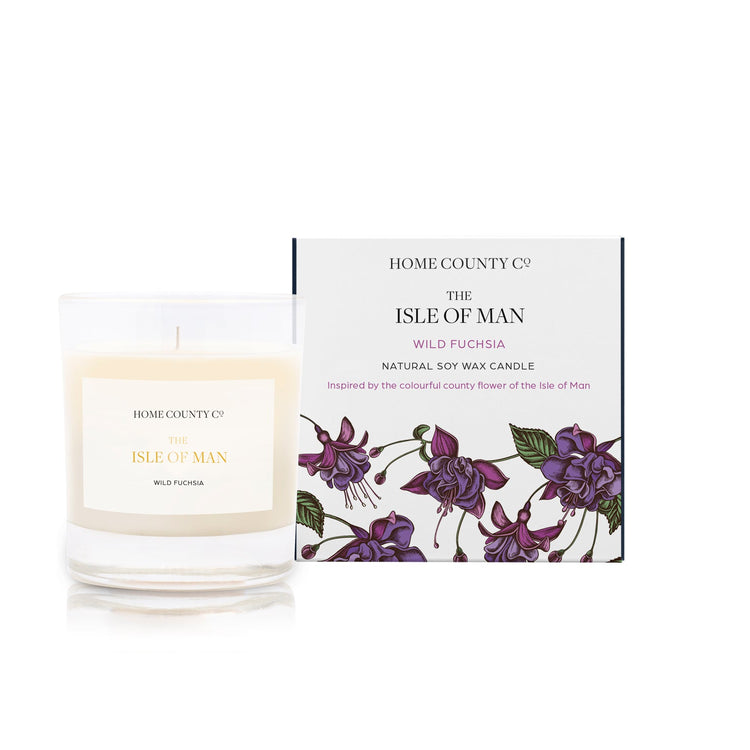 A wild fuchsia scented soy wax candle inspired by the Isle of Man is shown next to its sustainable candle box with fuchsia illustration