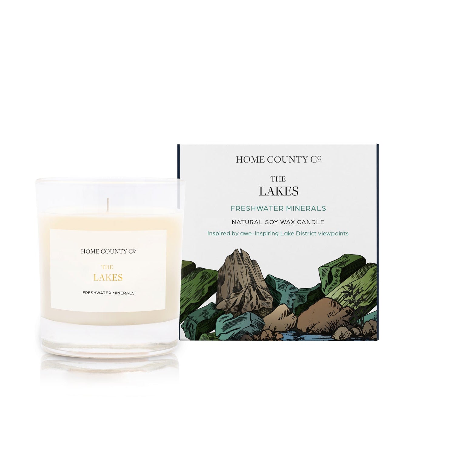 A freshwater minerals scented soy wax candle inspired by the Lake District is shown next to its sustainable candle box with lakeside illustration