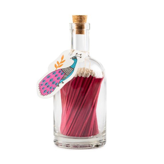 A luxury bottle of purple matches from the Home County Co. with a peacock design tag