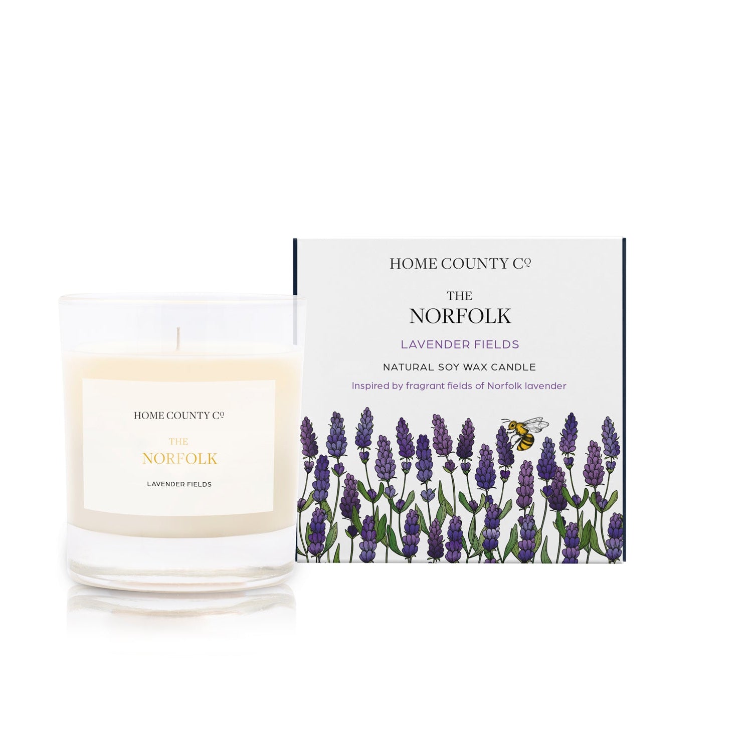 A lavender scented soy wax candle inspired by Norfolk lavender fields is shown next to its sustainable candle box with lavender illustration