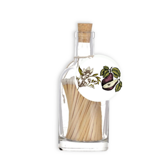 A luxury glass match bottle from the Home County Co. with Pear and Freesia illustrated gift tag.