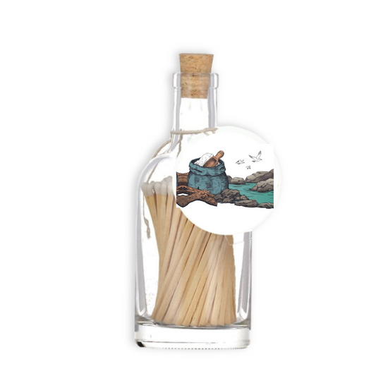 A luxury glass match bottle from the Home County Co. with rock pool illustrated gift tag.