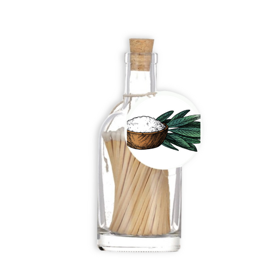 A luxury glass match bottle from the Home County Co. with Sage and Sea Salt illustrated gift tag.