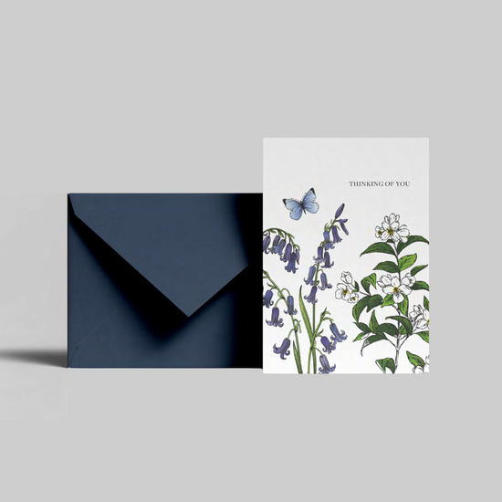 A thinking of you card with bluebell illustration from the Home County Co. is shown with its navy envelope.