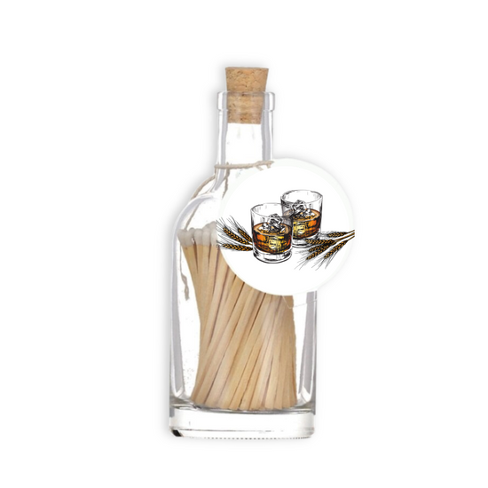 A luxury glass match bottle from the Home County Co. with whiskey tumbler illustrated gift tag.
