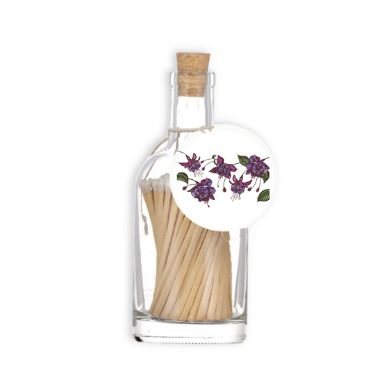A luxury glass match bottle from the Home County Co. with Wild Fuchsia illustrated gift tag.
