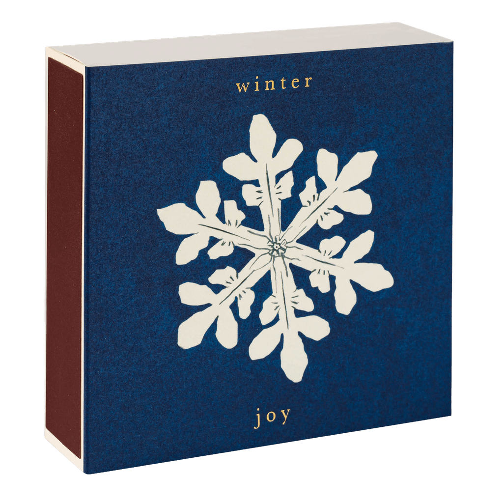 A box of Archivist matches with a Winter Joy snowflake design is shown closed with striker on the side.