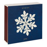A box of Archivist matches with a Winter Joy snowflake design is shown closed with striker on the side.