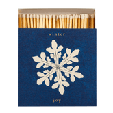 A box of Archivist matches with a Winter Joy snowflake design is shown open with 125 white tipped long matches inside