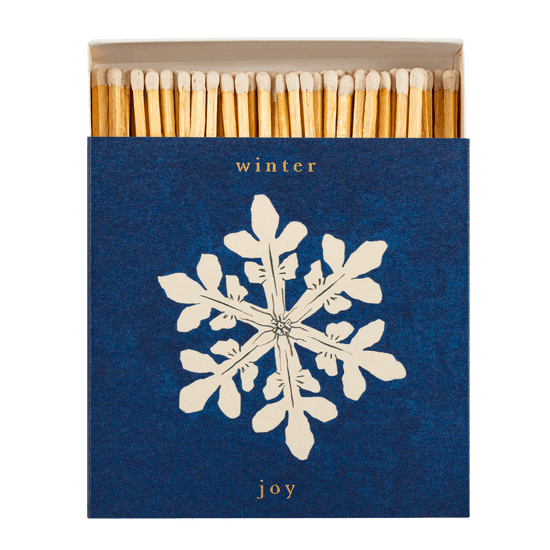 A box of Archivist matches with a Winter Joy snowflake design is shown open with 125 white tipped long matches inside