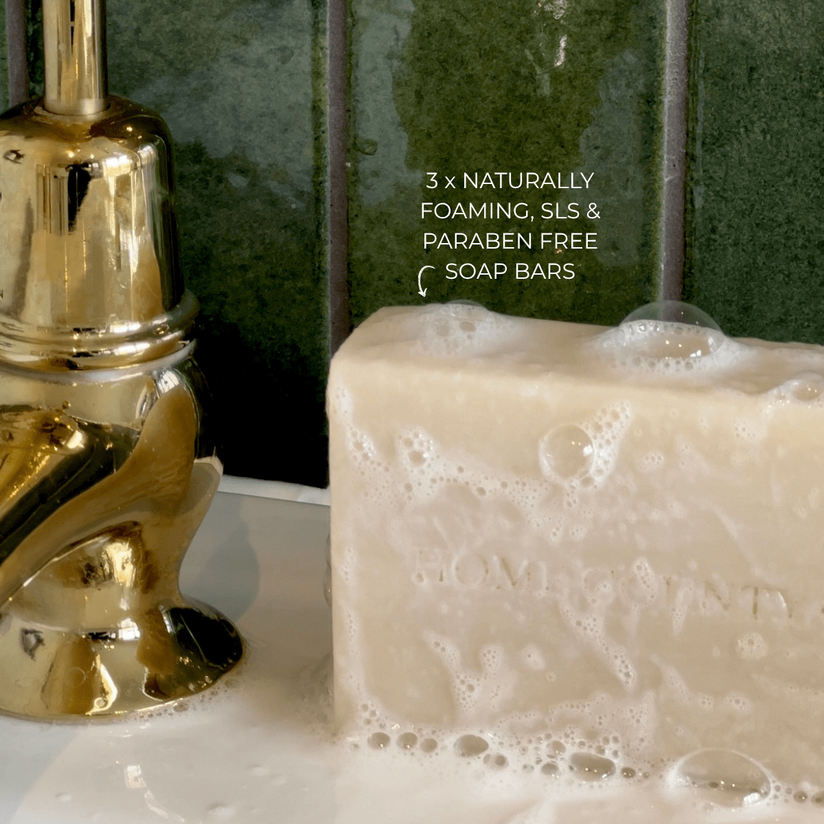 Home County Co. soap bar is shown on a sink with naturally foaming bubbles from the SLS and Paraben Free soap bar