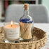 Home County Co Northamptonshire candle shown with bottle of luxury matches