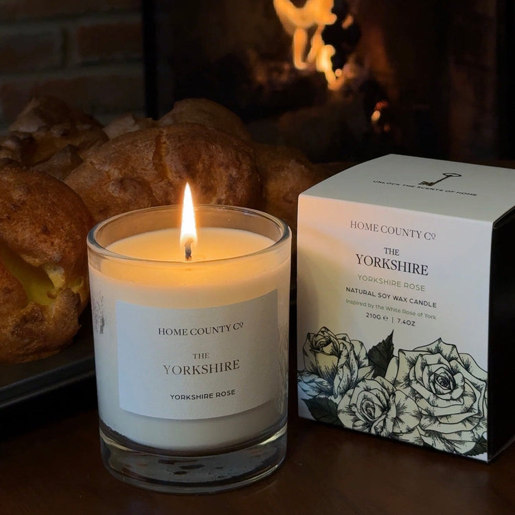 White Rose scented candle and packaging labeled &