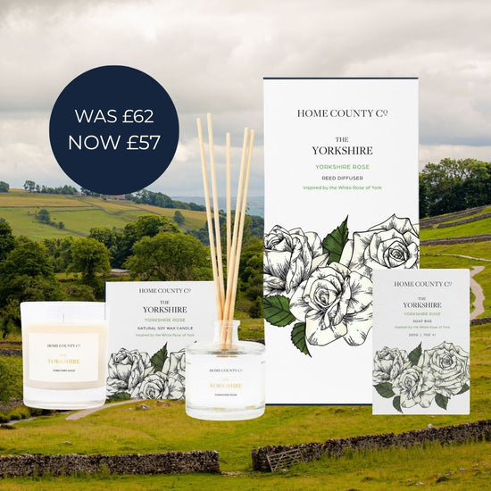 Home County Co. Yorkshire candle reed diffuser and soap bar set displayed against a green countryside background in the Yorkshire Dales. 
