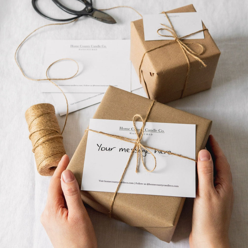 Candle gift wrap - a candle is gift wrapped with natural kraft paper and secured with natural jute twine with an optional gift message