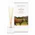A heather and gorse scented reed diffuser from Home County Co. The vegan friendly reed diffuser is shown next to the eco friendly reed diffuser box packaging.