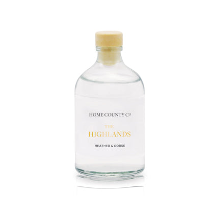 A heather and gorse scented reed diffuser refill from Home County Co. The eco friendly reed diffuser refill is shown in its recyclable glass bottle.