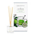 A green tea and bergamot scented reed diffuser from Home County Co. The vegan friendly reed diffuser is shown next to the eco friendly reed diffuser box packaging.